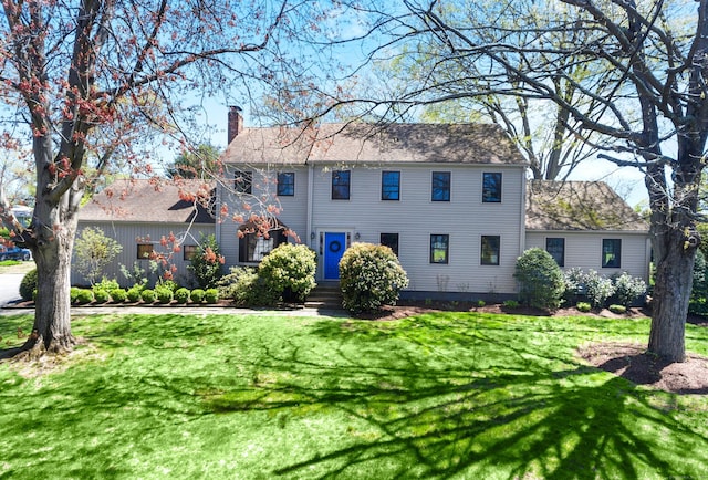 245 Sailors Ln, Bridgeport, CT 06605 - colonial inspired home with a chimney and a front yard