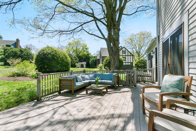 deck featuring a yard and outdoor lounge area