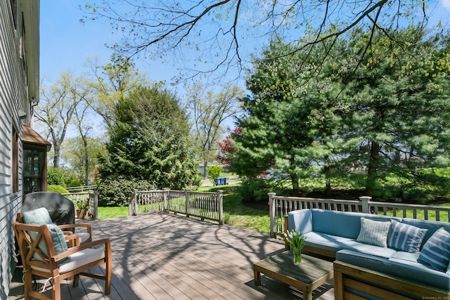 wooden deck featuring an outdoor hangout area