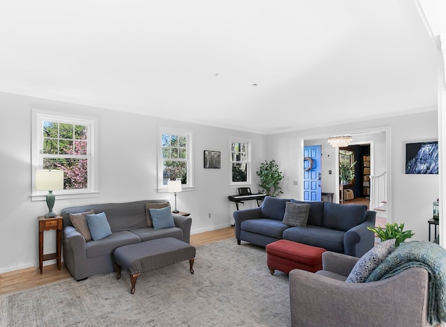 living room with baseboards, a wealth of natural light, and wood finished floors