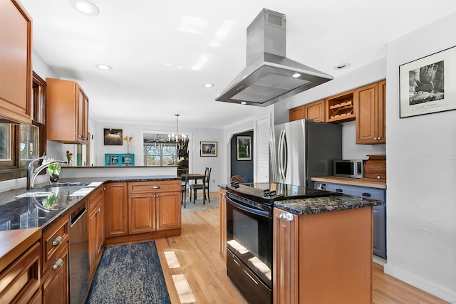 245 Sailors Ln, Bridgeport, CT 06605 - kitchen with appliances with stainless steel finishes, a sink, a chandelier, a peninsula, and island range hood