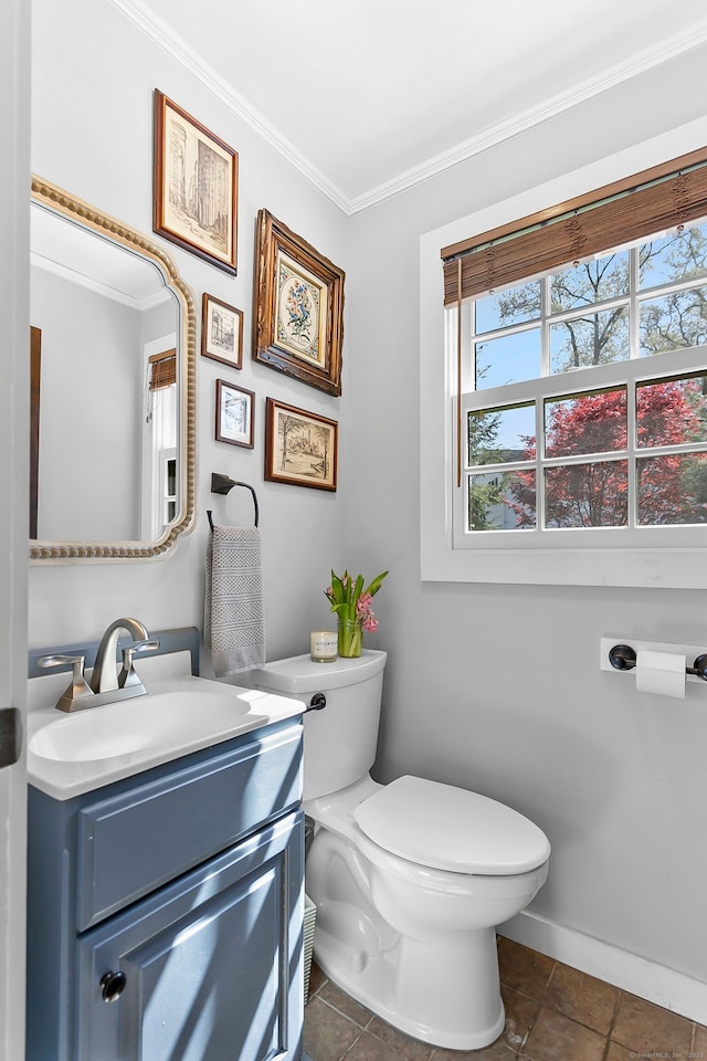 bathroom featuring crown molding, toilet, tile patterned flooring, and vanity