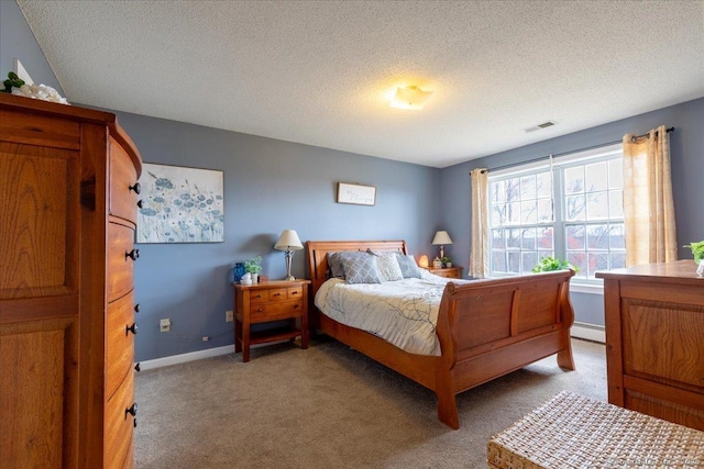 bedroom featuring a textured ceiling, visible vents, a baseboard heating unit, and light carpet