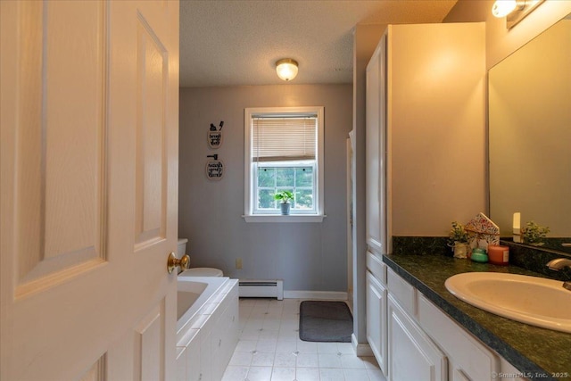 bathroom with a textured ceiling, baseboard heating, baseboards, tile patterned floors, and vanity