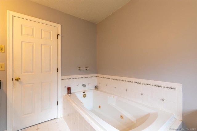 full bath with tile patterned flooring and a jetted tub