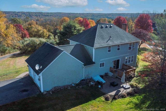 drone / aerial view with a view of trees