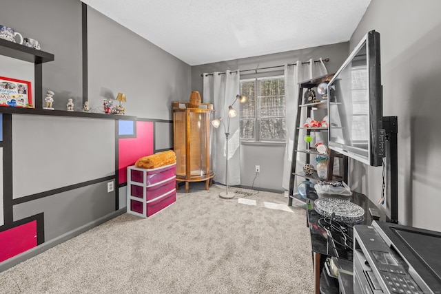 recreation room featuring baseboards and carpet flooring