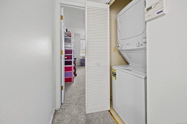 clothes washing area with light colored carpet, laundry area, and stacked washing maching and dryer