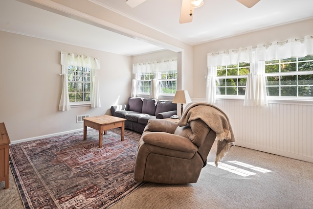 living room featuring visible vents, carpet flooring, and ceiling fan