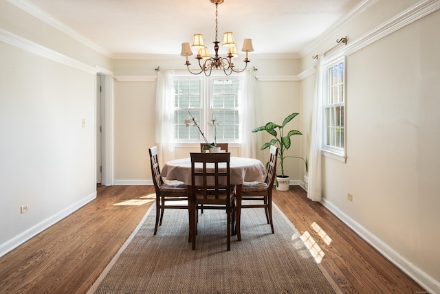 dining area featuring baseboards, dark wood-style floors, and a notable chandelier