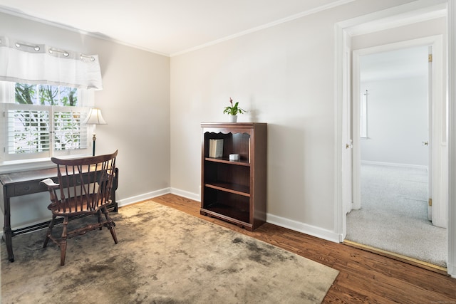 office area featuring baseboards, ornamental molding, and wood finished floors