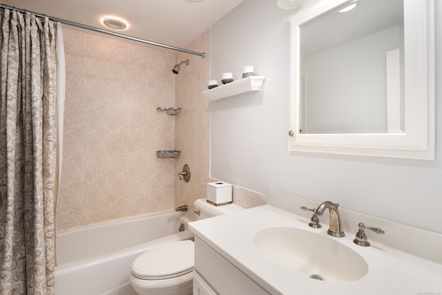bathroom featuring vanity, shower / bath combination with curtain, and toilet