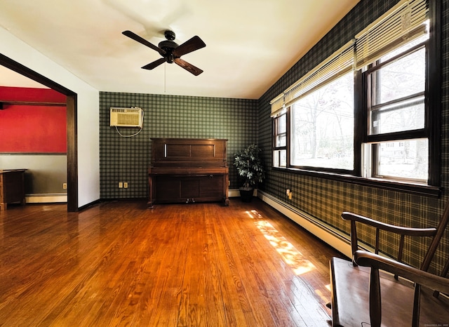 653 Andrew Mountain Rd, Naugatuck, CT 06770 - unfurnished room featuring a wall unit AC, ceiling fan, wallpapered walls, baseboards, and wood finished floors