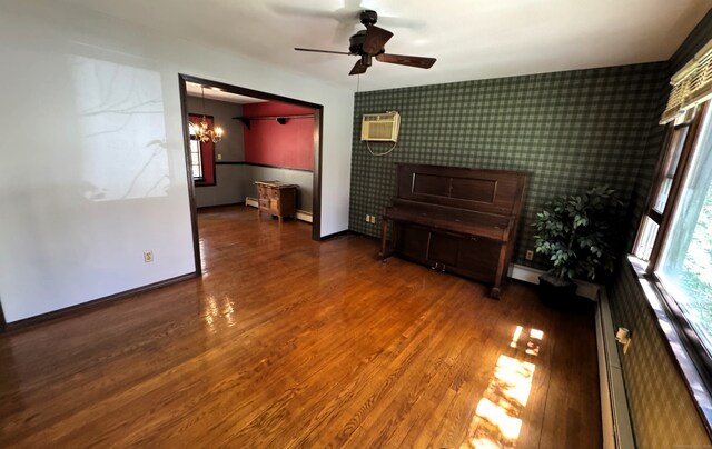 653 Andrew Mountain Rd, Naugatuck, CT 06770 - unfurnished room with baseboards, wood finished floors, and plenty of natural light