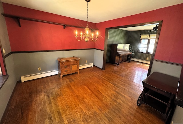 653 Andrew Mountain Rd, Naugatuck, CT 06770 - dining room with a chandelier, wood finished floors, and a baseboard heating unit