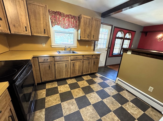 653 Andrew Mountain Rd, Naugatuck, CT 06770 - kitchen with brown cabinets, a sink, black range with electric stovetop, light countertops, and baseboard heating
