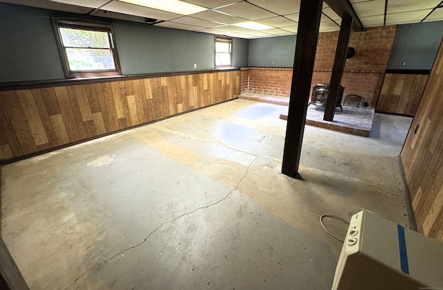 653 Andrew Mountain Rd, Naugatuck, CT 06770 - below grade area featuring a wainscoted wall, wooden walls, and a drop ceiling