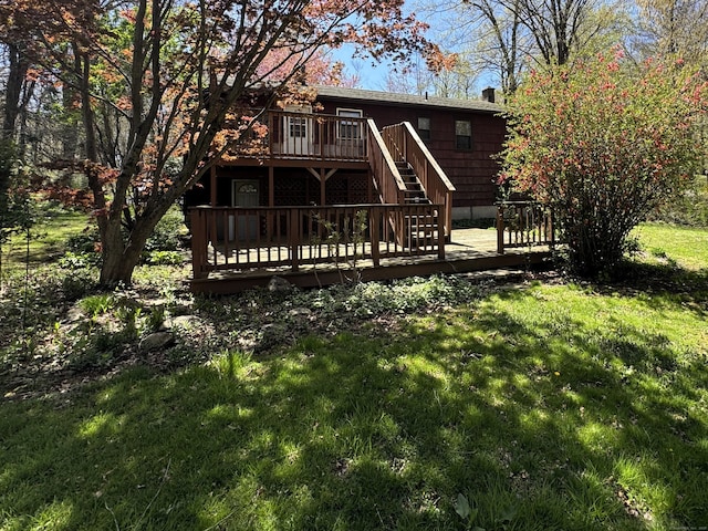 653 Andrew Mountain Rd, Naugatuck, CT 06770 - back of property featuring stairway, a deck, and a yard