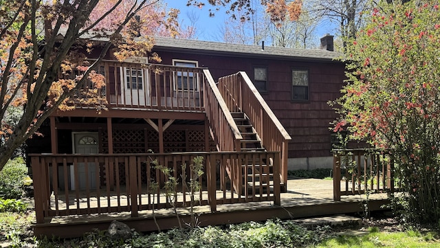 653 Andrew Mountain Rd, Naugatuck, CT 06770 - back of house featuring a deck, a shingled roof, and a chimney