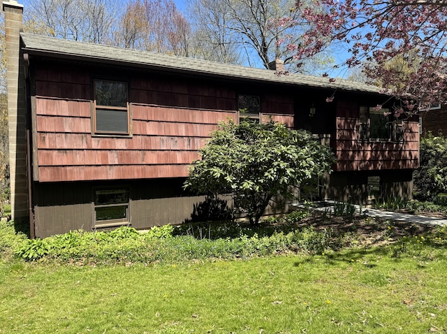 653 Andrew Mountain Rd, Naugatuck, CT 06770 - view of side of home with a chimney and a lawn