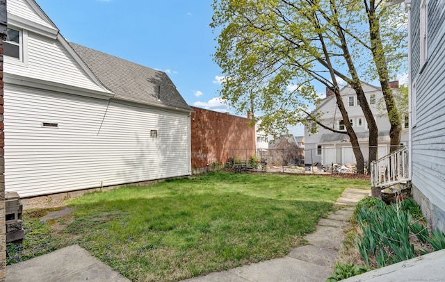 view of yard featuring fence