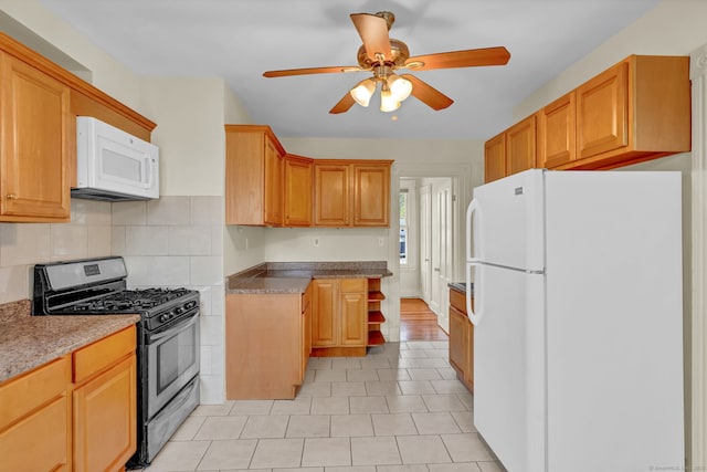kitchen featuring tasteful backsplash, ceiling fan, white appliances, and light tile patterned flooring