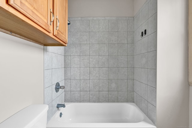 bathroom with toilet and shower / washtub combination