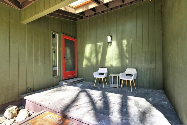view of exterior entry featuring a patio