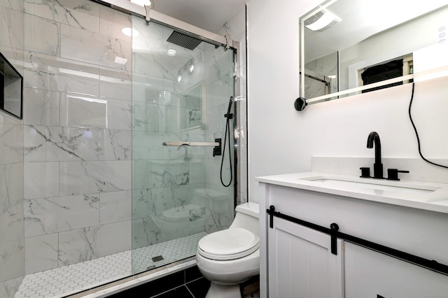 full bathroom featuring toilet, visible vents, a marble finish shower, and vanity