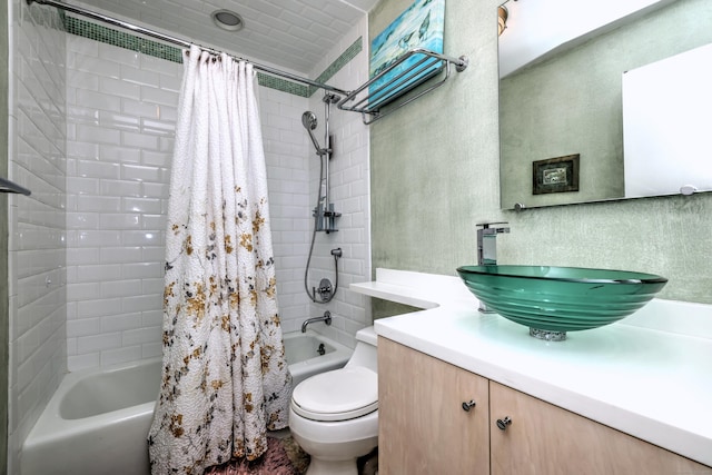 bathroom with vanity, shower / bath combo, and toilet