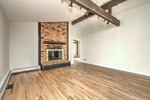 unfurnished living room featuring baseboard heating, a fireplace, vaulted ceiling with beams, visible vents, and hardwood / wood-style flooring