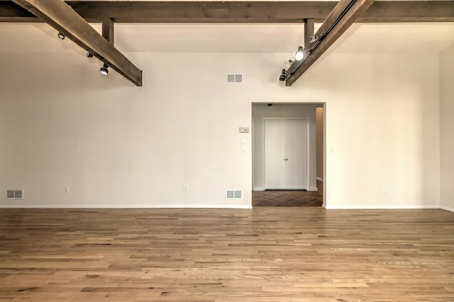 garage featuring visible vents and baseboards