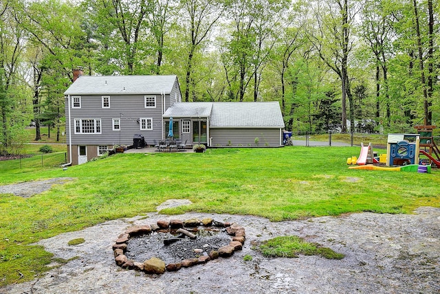 267 Foote Rd, Glastonbury, CT 06073 - rear view of property with an outdoor fire pit, a patio, a chimney, and a playground