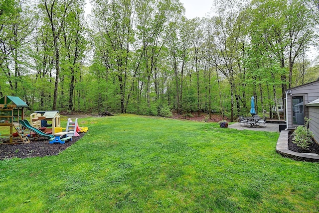 267 Foote Rd, Glastonbury, CT 06073 - view of green lawn featuring a playground and a patio area