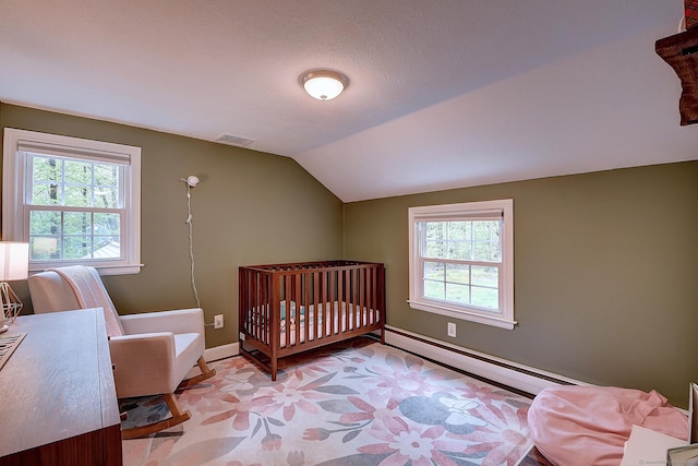 267 Foote Rd, Glastonbury, CT 06073 - bedroom featuring baseboard heating, multiple windows, lofted ceiling, baseboards, and light floors