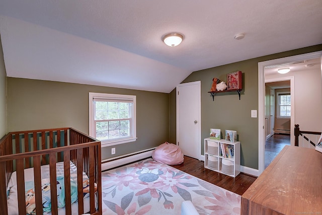 267 Foote Rd, Glastonbury, CT 06073 - bedroom featuring baseboard heating, wood finished floors, a baseboard heating unit, vaulted ceiling, and baseboards
