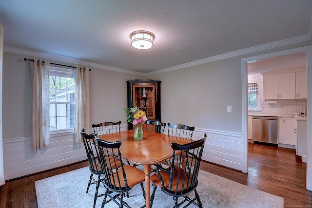 267 Foote Rd, Glastonbury, CT 06073 - dining space featuring crown molding, wainscoting, and dark wood finished floors