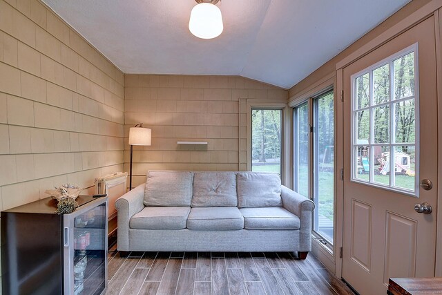 267 Foote Rd, Glastonbury, CT 06073 - living area with lofted ceiling, wood finished floors, and beverage cooler