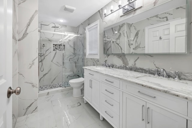 full bath with toilet, a marble finish shower, a sink, and marble finish floor