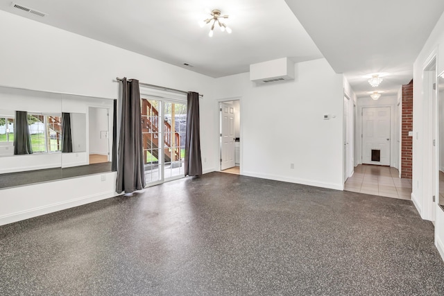 unfurnished living room with visible vents and baseboards
