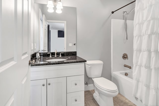 bathroom with vanity, shower / bath combination with curtain, a notable chandelier, toilet, and tile patterned flooring