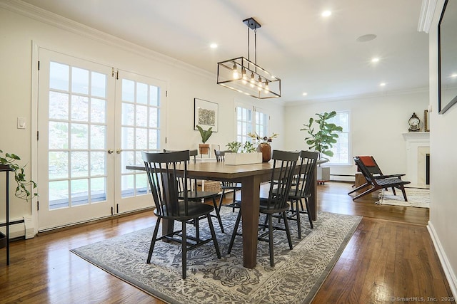 dining room featuring recessed lighting, a baseboard heating unit, dark wood finished floors, and baseboards