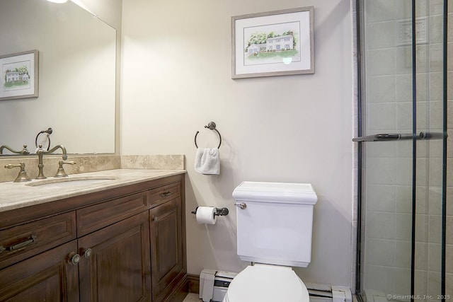 bathroom with vanity, a baseboard radiator, a tile shower, and toilet