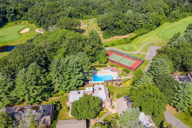 birds eye view of property with a water view and view of golf course
