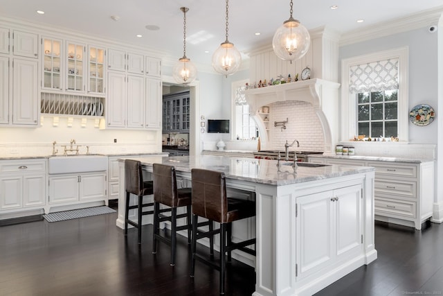 35 Club Rd, Greenwich, CT 06878 - kitchen featuring dark wood-style flooring, white cabinetry, a center island with sink, and a sink