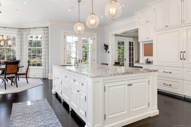 35 Club Rd, Greenwich, CT 06878 - kitchen with white cabinetry, plenty of natural light, a center island with sink, and a sink