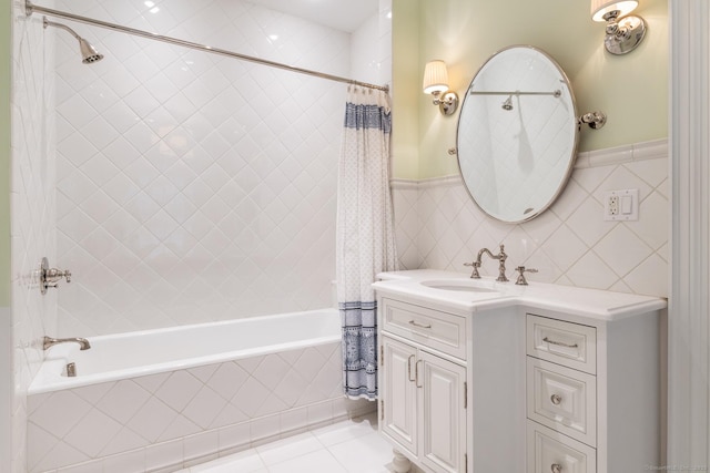 35 Club Rd, Greenwich, CT 06878 - full bath featuring a wainscoted wall, tile patterned flooring, vanity, and tiled shower / bath