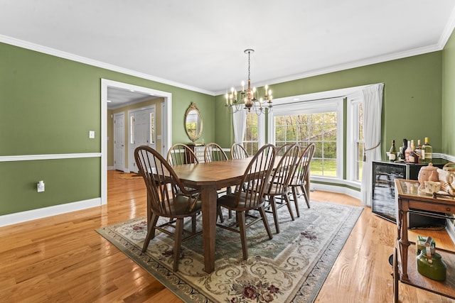 74 High St, Portland, CT 06480 - dining area featuring crown molding, baseboards, an inviting chandelier, and light wood-style flooring