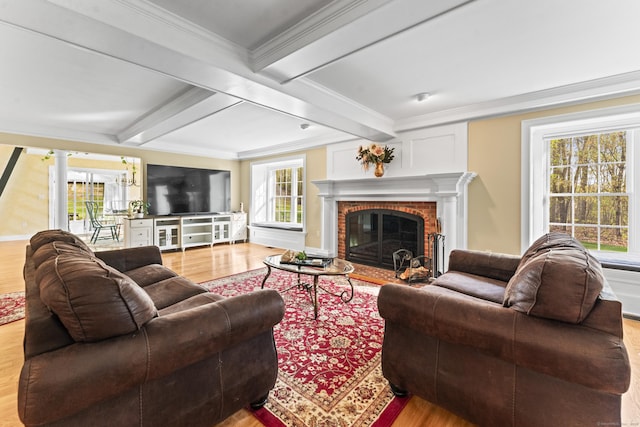 74 High St, Portland, CT 06480 - living area featuring crown molding, a brick fireplace, wood finished floors, and beamed ceiling