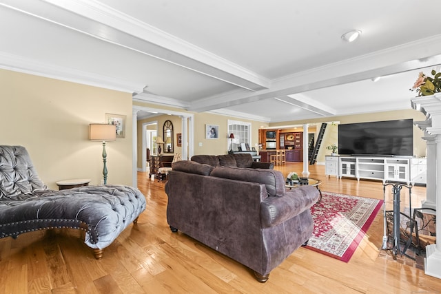 74 High St, Portland, CT 06480 - living area with ornate columns, beamed ceiling, ornamental molding, and light wood-style floors